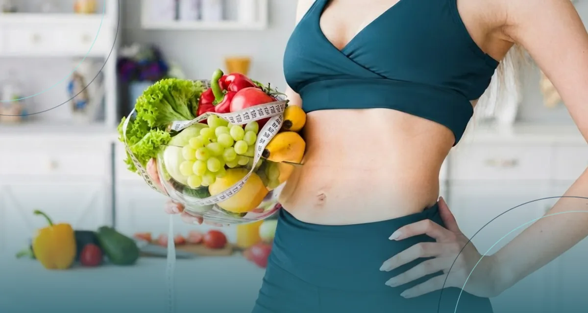 Woman in teal activewear holding a bowl of fresh produce and a tape measure
